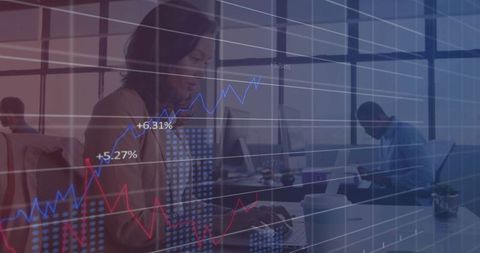 Woman Analyzing Financial Data on Laptop in Modern Office Environment