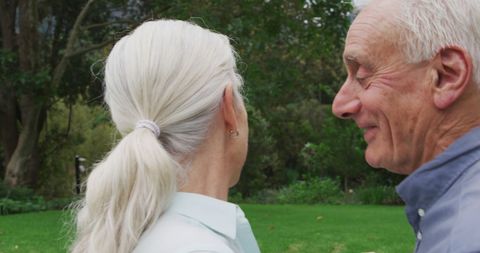 Senior couple having a pleasant outdoor moment with laughter
