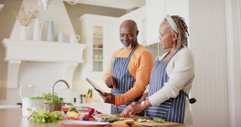 Senior African American Couple Cooking with Tablet in Sunlit Kitchen - Download Free Stock Images Pikwizard.com
