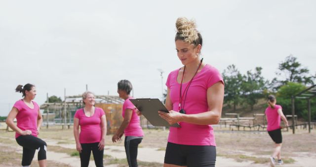 Female Fitness Instructor Leading Outdoor Group Exercise - Download Free Stock Images Pikwizard.com