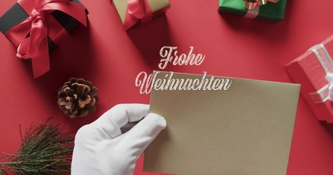 Santa Writing on Christmas Card with Gifts and Decorations - Download Free Stock Images Pikwizard.com