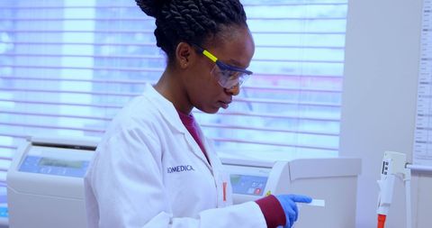 Healthcare Professional Analyzing Blood Sample in Lab