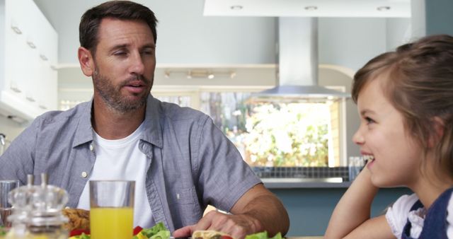 Father Having Meal with Daughter in Modern Kitchen - Download Free Stock Images Pikwizard.com