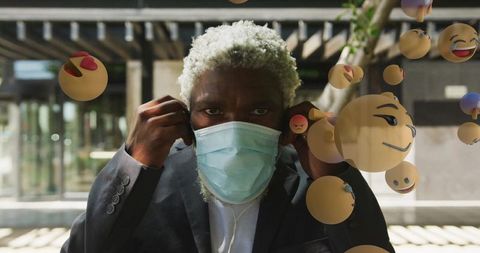 Businessman Wearing Mask With Expressive Emoji Surroundings Outdoors