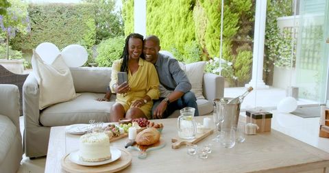 Outdoor Celebration with Couple Sharing Cake and Laughter