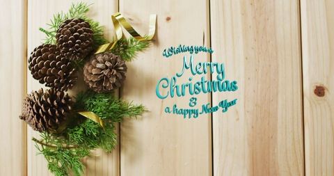 Rustic Christmas Greeting with Pinecones on Wooden Background