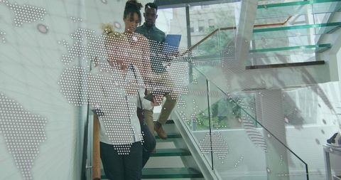 Business Team Ascending Stairs with World Map Overlay