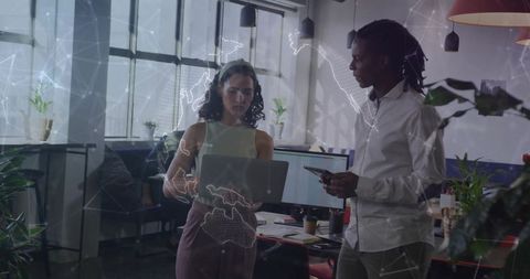 Team Collaborating in Modern Open-Plan Office on Technology Projects