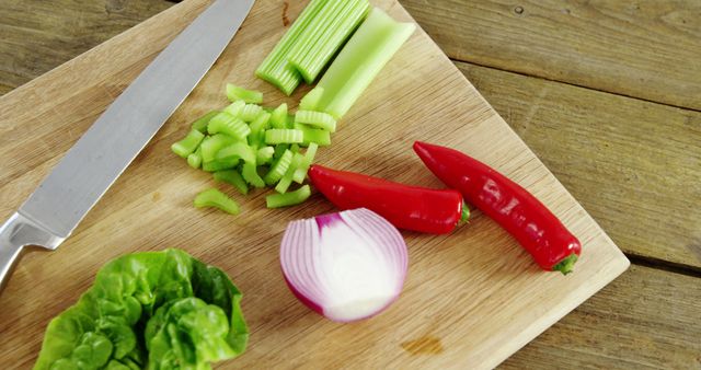 Preparing Fresh Vegetables on Wooden Cutting Board in Kitchen - Download Free Stock Images Pikwizard.com