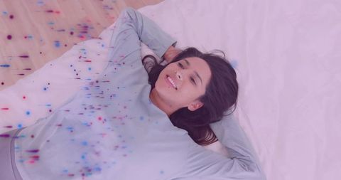 Relaxed Woman Enjoying Serenity in Cozy Bedroom