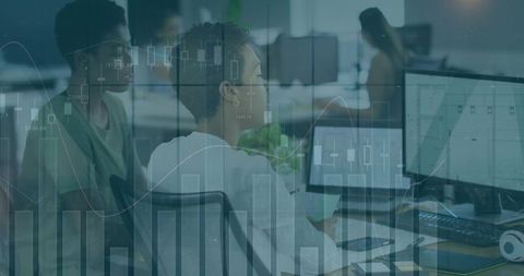 Women reviewing financial dashboards on dual monitors in office, collaborating on data analytics