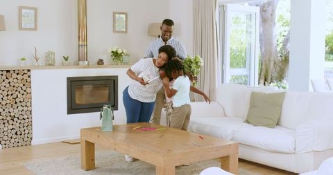 Family Bonding and Laughter in Cozy Living Room Environment