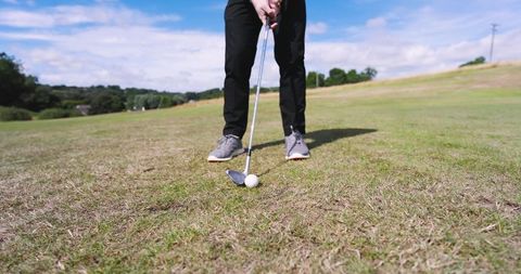 Golfer Ready to Swing on Sunny Course Day