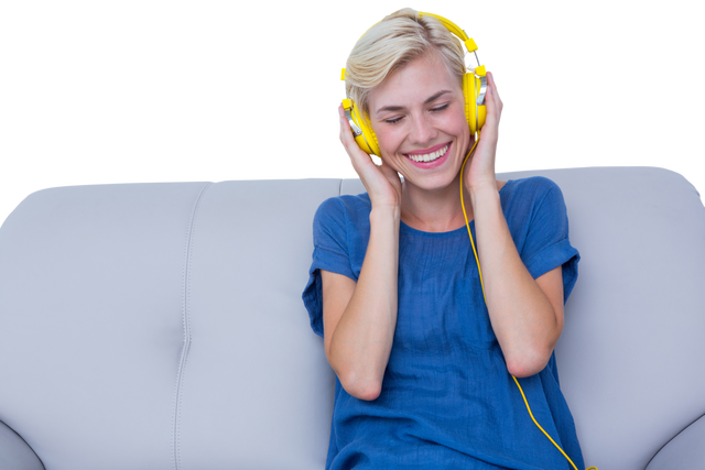 Cheerful Woman with Yellow Headphones Relaxing on Sofa - Transparent Background - Download Free Stock Videos Pikwizard.com