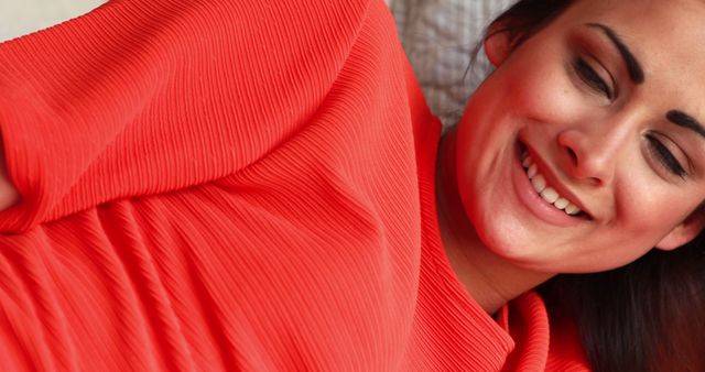 Smiling Woman in Red Top Relaxing Indoors - Download Free Stock Images Pikwizard.com
