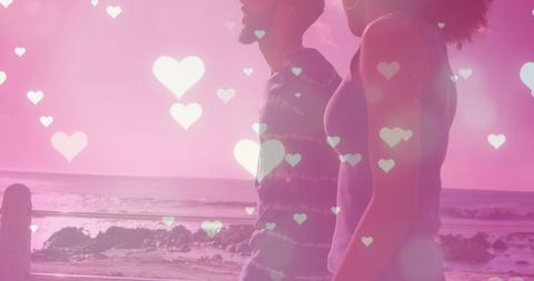 Romantic Coastal Walk with Floating Hearts Overlay