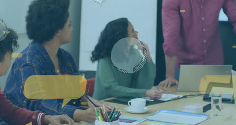 Team Brainstorming in Modern Office with Digital Speech Bubbles