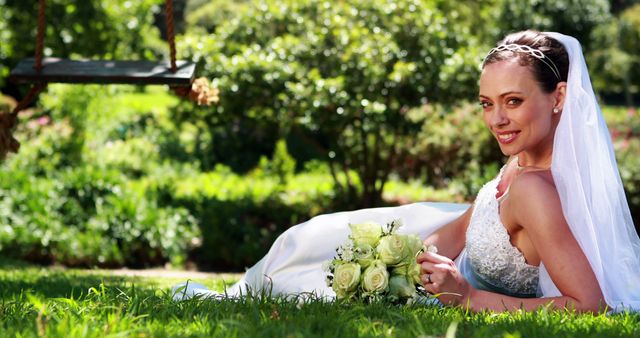 Smiling Bride in White Dress Holding Rose Bouquet on Grassy Lawn - Download Free Stock Images Pikwizard.com