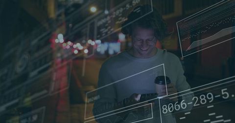 Man Engages with Futuristic Data Overlays in Urban Night Scene