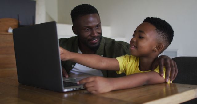 Father and Son Spending Time Learning with Laptop at Home - Download Free Stock Images Pikwizard.com