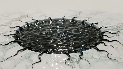 Black viscous liquid pool on marble with radiating tendrils