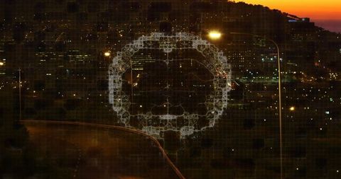 Translucent circular hologram overlaying urban hillside at dusk with highway light trails