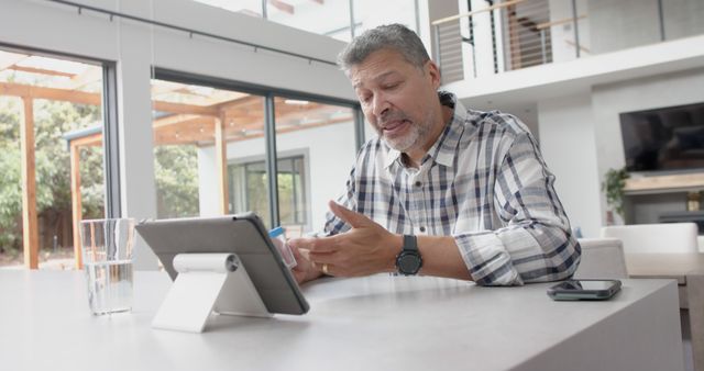 Older Man Participates in Video Call from Home - Download Free Stock Images Pikwizard.com