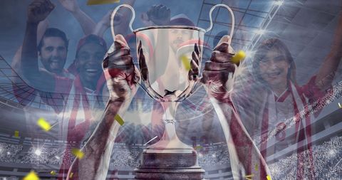Hands holding trophy amidst celebrating diverse fans in stadium