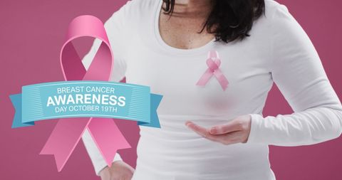Woman Wearing Pink Ribbon in Support of Breast Cancer Awareness