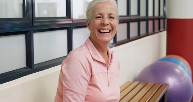 Senior Woman Smiling and Exercising at Gym - Download Free Stock Images Pikwizard.com