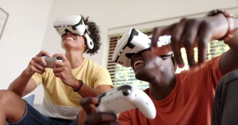 Diverse Friends Engaging in a VR Gaming Session at Home