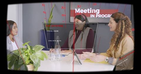 Three businesswomen discussing project with futuristic hud overlay in modern meeting room