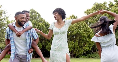 Happy Family Enjoying Time Together in Lush Garden