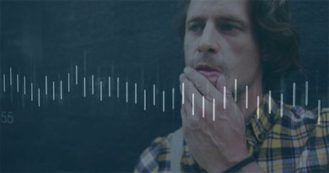 Pensive man touching chin with soundwave overlay in moody lowkey closeup portrait studio