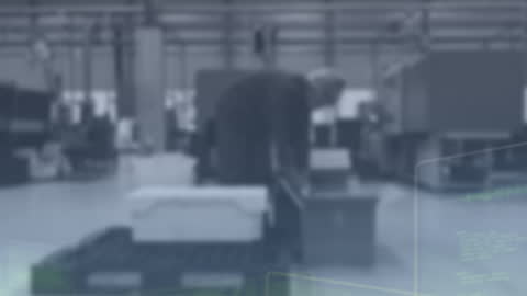 Businessman Analyzing Data in Modern Factory Setting