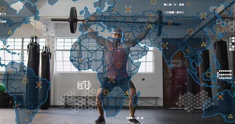 Middle-aged athlete lifting loaded barbell overhead in gym with futuristic ui overlay