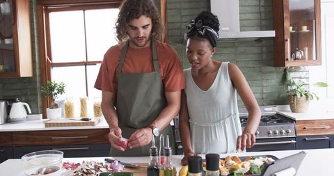 Couple Cooking Together in Modern Kitchen with Fresh Ingredients