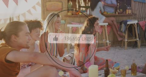 Friends Enjoying Beach Party with Overlay of Social Media Likes