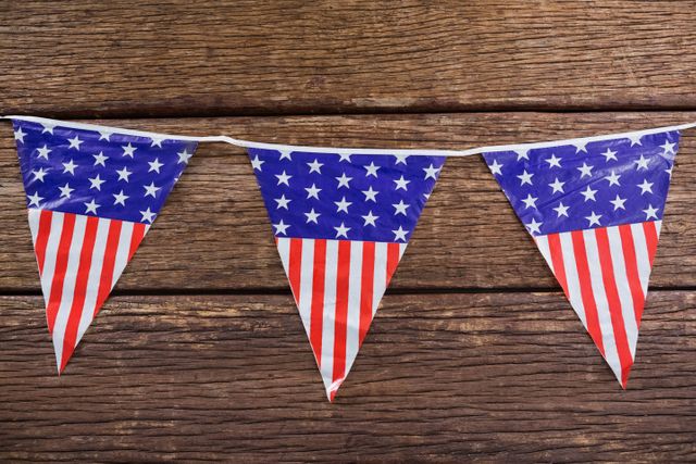 Patriotic Bunting with American Flag Design on Wooden Table - Download Free Stock Photos Pikwizard.com