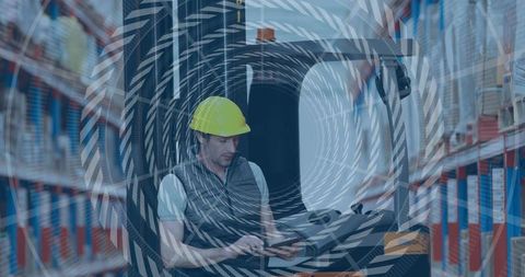 Forklift operator using tablet in warehouse aisle wearing yellow hard hat, inventory overlay