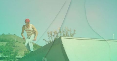 Young skateboarder practicing tricks at urban skate park