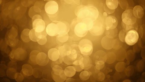 Glowing Golden Bokeh Background Creating Warm Glow and Soft Circular Light Halos