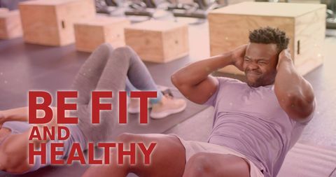 Diverse Fitness Enthusiasts Exercising in Gym Setting