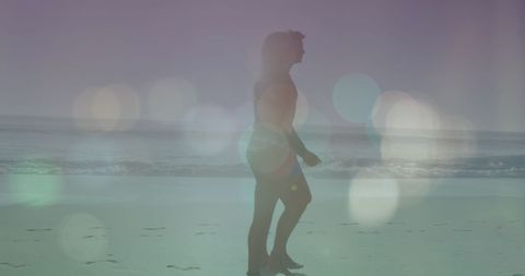 Silhouette Couple Walking on Beach with Dreamy Lens Flares - Download Free Stock Images Pikwizard.com