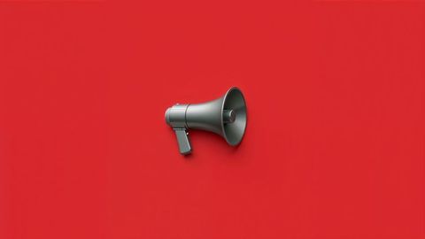 Grey Megaphone Against Bold Red Background Symbolizing Communication