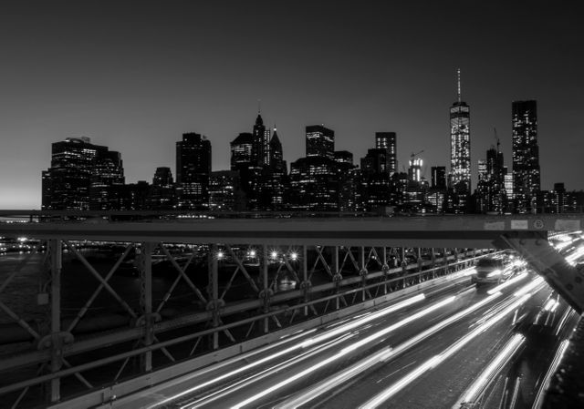 Night View of Manhattan Skyline with Light Trails on Brooklyn Bridge - Download Free Stock Photos Pikwizard.com