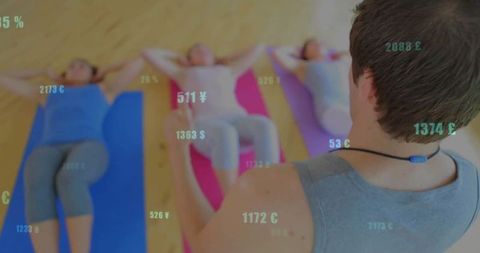 Instructor Guiding Women During Fitness Class with Digital Currency Overlay