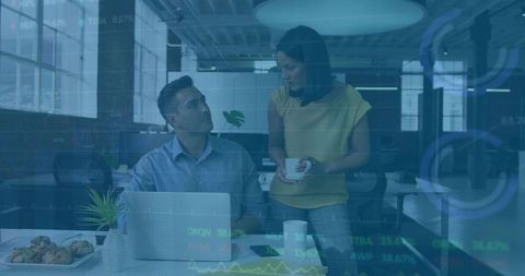 Coworkers Collaborating in Contemporary Office Environment