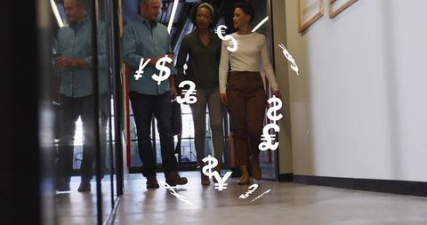 Walking Professionals with Floating Currency Symbols in Modern Office
