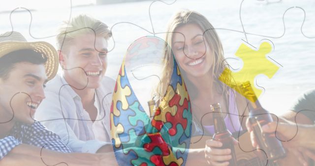 Image of colourful puzzle pieces ribbon over happy friends at summer beach party. autism, learning difficulties, support and awareness concept digitally generated image.